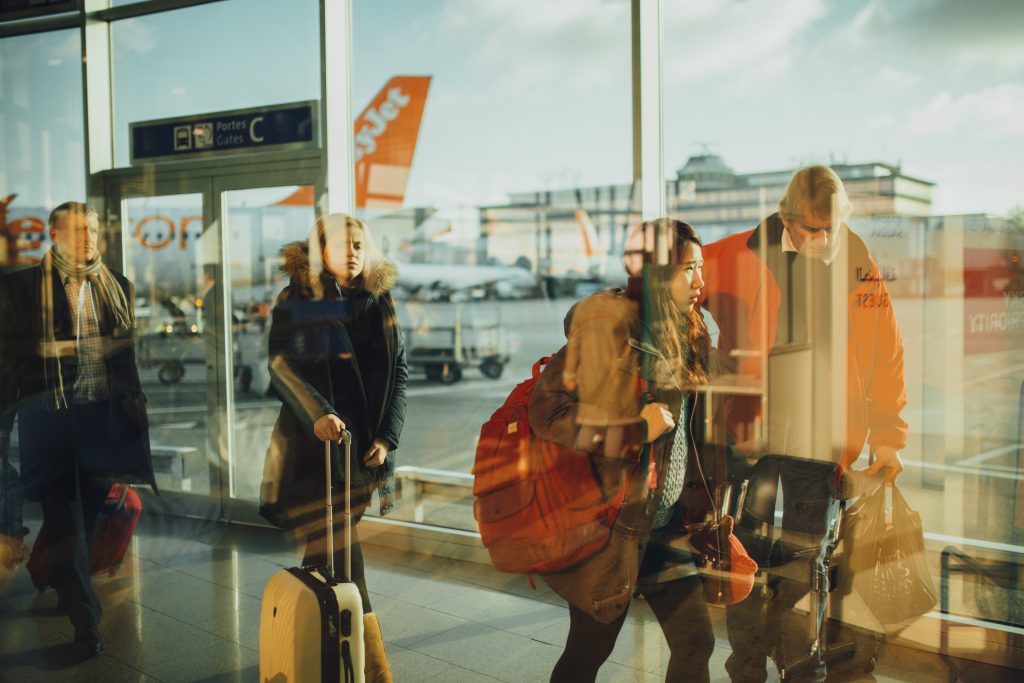 People Walking at Airport with Bags