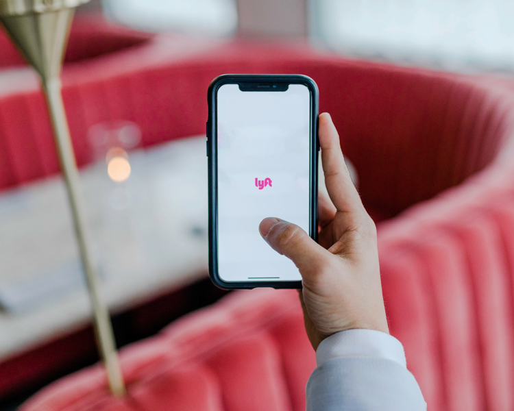 Image of person using Lyft mobile app