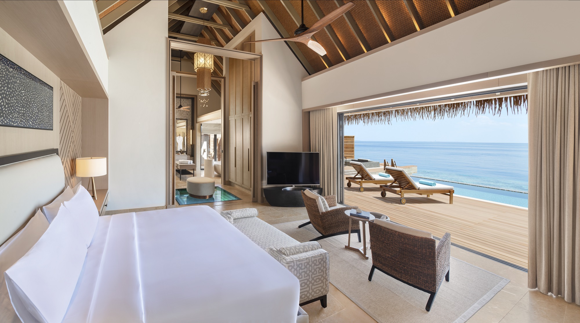 a bedroom at a luxury ocean-front hotel property