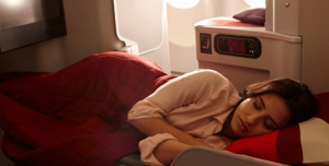 a woman sleeping in Iberia business class