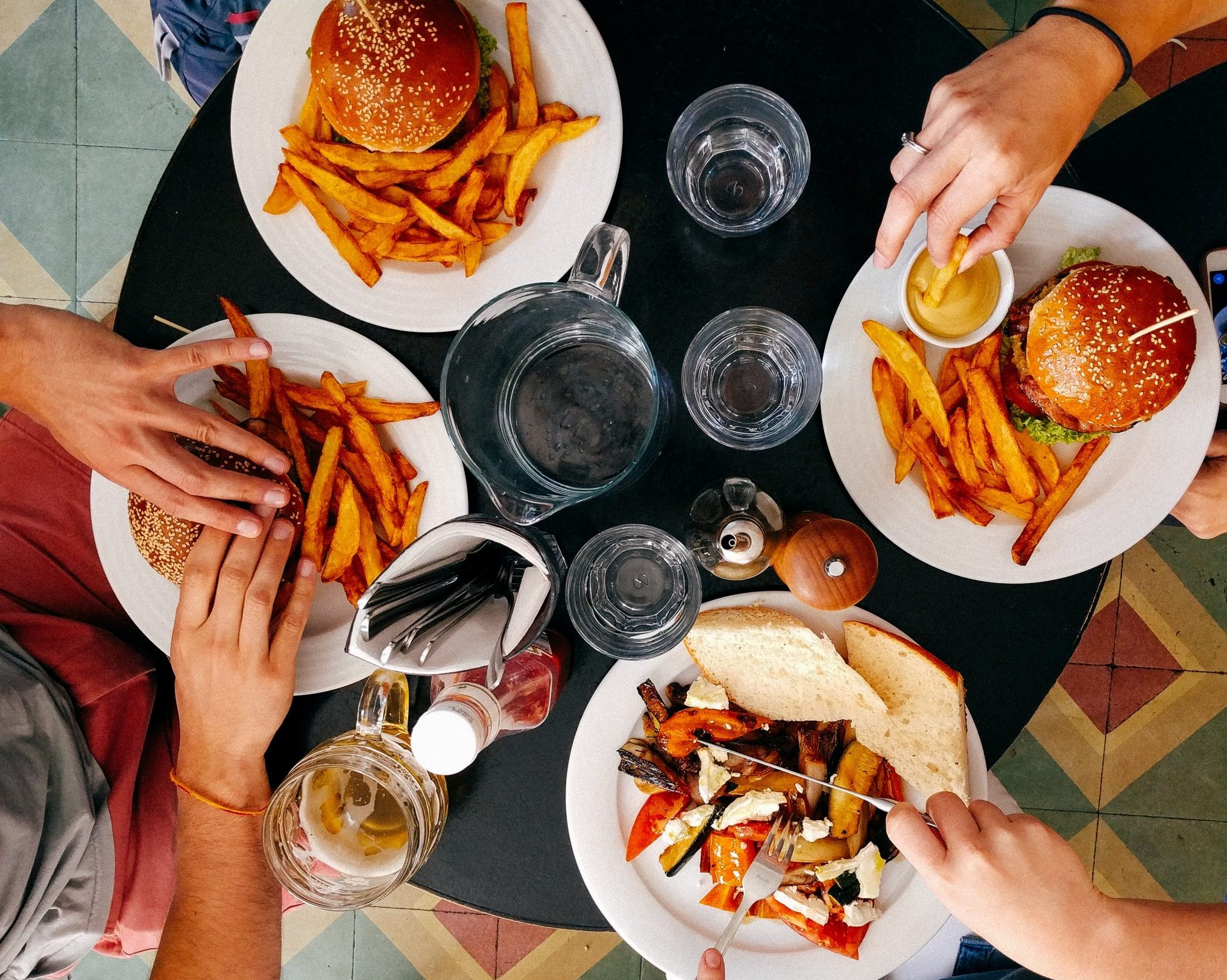 You can use your Hilton Surpass $50 credit to cover a meal at a Hilton's property restaurant.