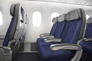 An empty row of economy seats on an American Airlines aircraft