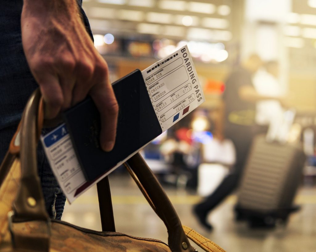 Photo of a person carrying a boarding pass.