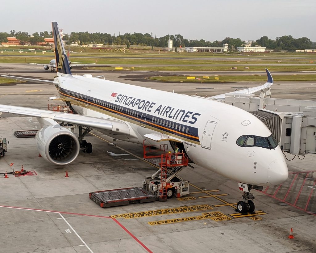 Singapore Airlines plane parked at a gate
