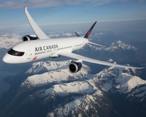 Image of Air Canada Dreamliner flying over the Rocky Mountains