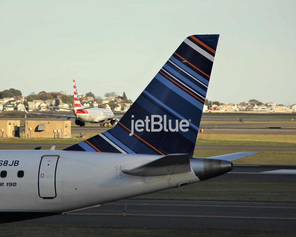 a plane's tail fin shows the JetBlue logo