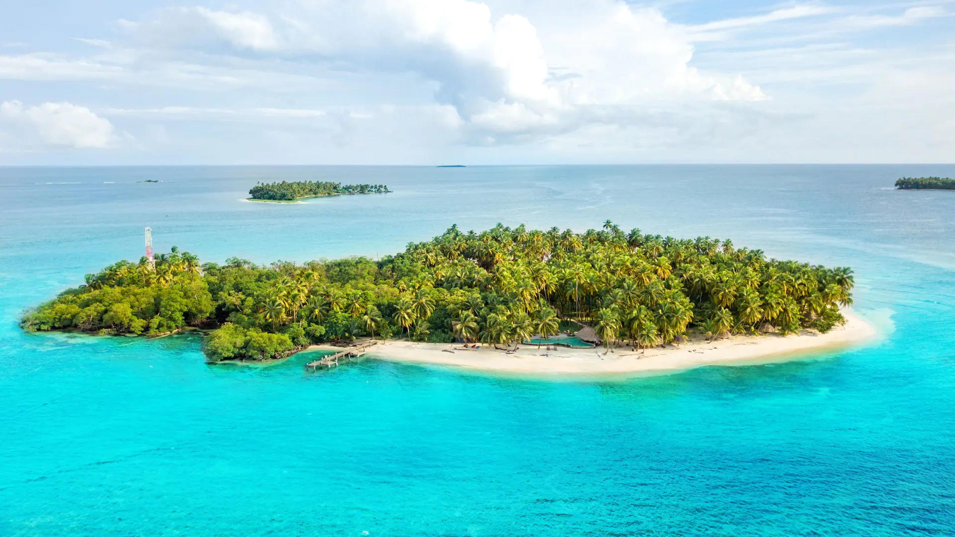 a small, private island with a luxury hotel tucked among the trees