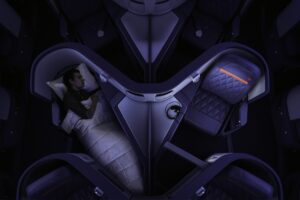 Overhead photo shows man sleeping in Delta One business class cabin on the Delta A330-300