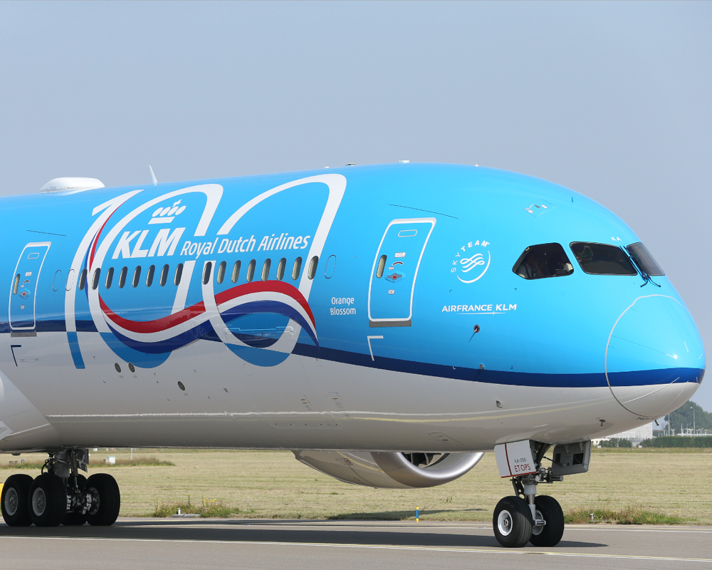 a KLM plane with 100 year anniversary branding on the side