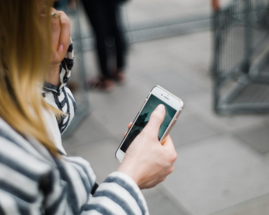 a person looks at their smart phone