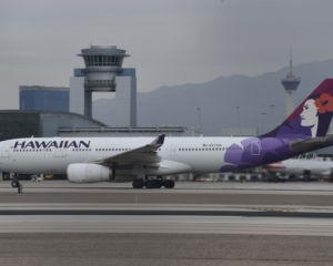 a Hawaiian Airlines plane taxiing at the Las Vegas airport