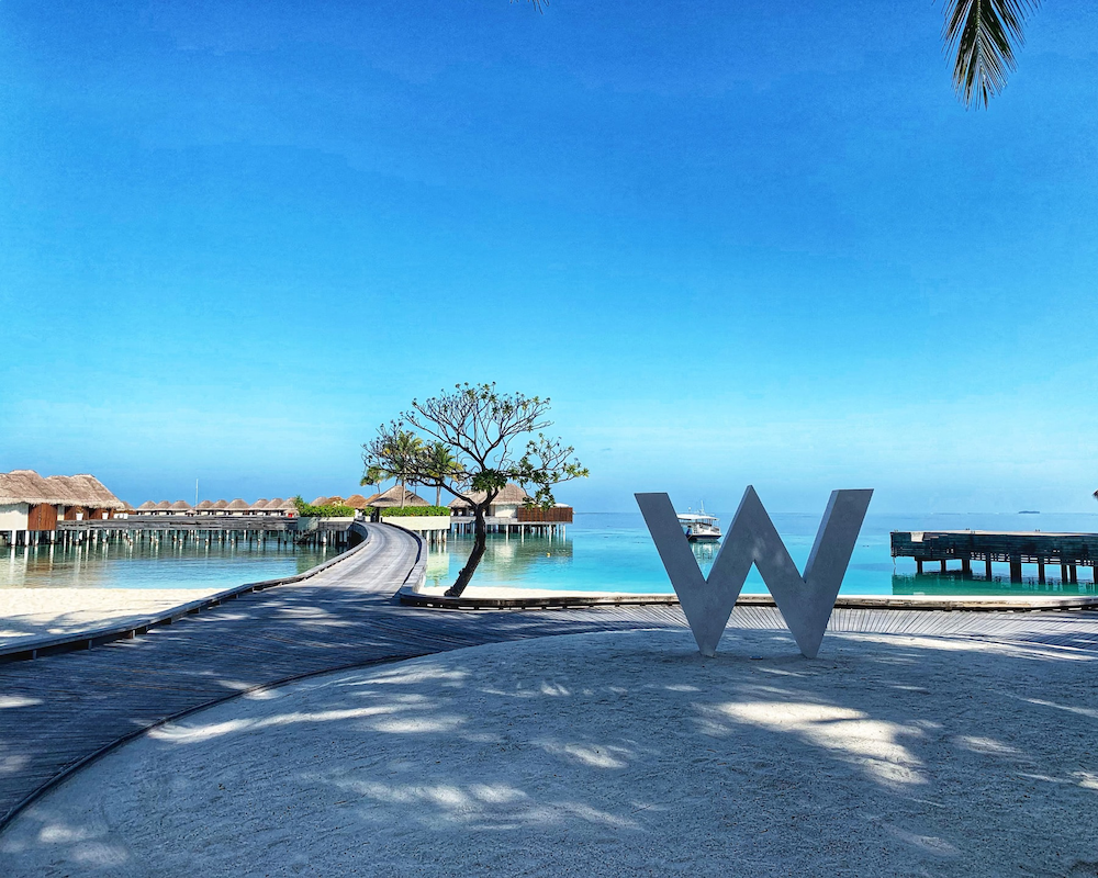 a large W sign at the W Maldives, a Marriott Bonvoy property