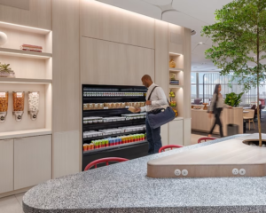 a visitor to an airport lounge looks at packaged meals in a fridge