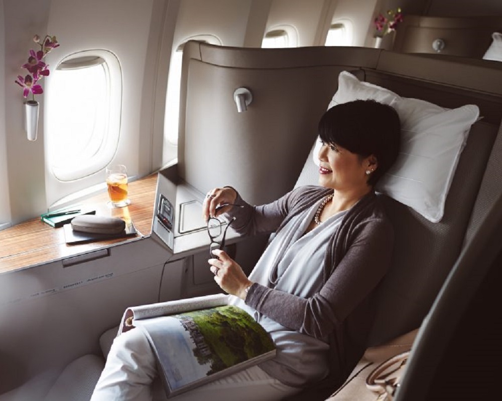A woman sitting in Cathay Pacific business class