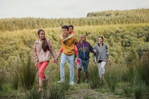 Family spending quality time together by hiking through the country side.