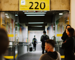 passengers wait at a gate for a delayed flight