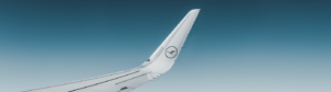a Lufthansa logo on a plane's winglet, seen from the plane window