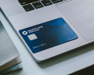 Chase Sapphire Preferred card sitting on a laptop.