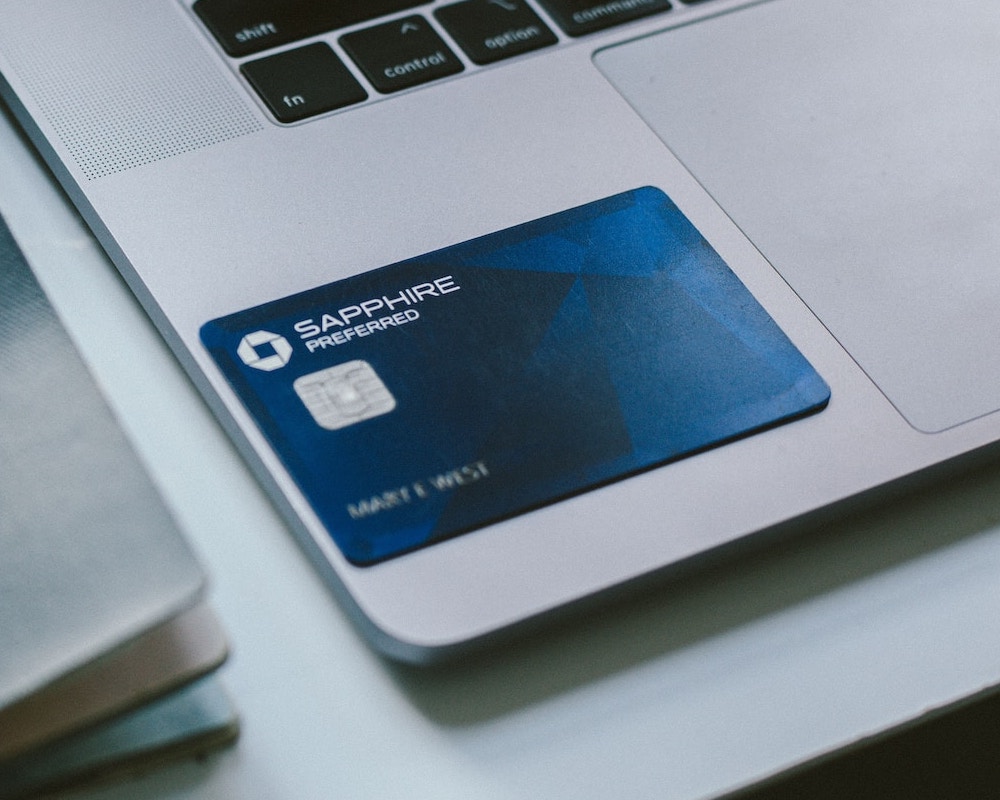 Chase card sitting on a laptop.