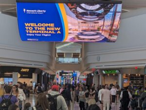 Photo of the interior of Newark Terminal A with a large display welcoming travelers to "the new Terminal A"