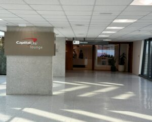 Photo showing Capital One Lounge signage on a column in the Washington Dulles airport terminal