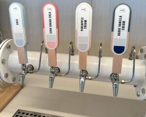 Photos of drink taps at the Capital One Lounge IAD