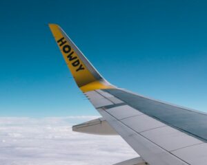 looking out a plane window to see the Spirit logo on a wingtip