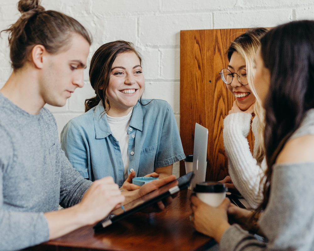 College students at a café talking together