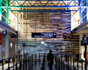a person approaches lines at airport security