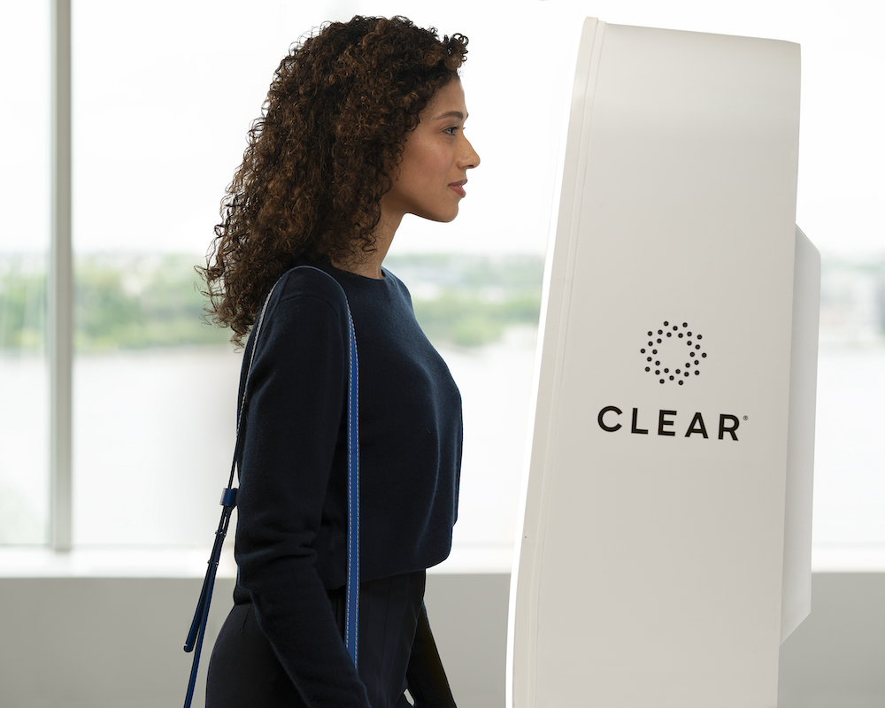 A woman scans here irises at a CLEAR kiosk
