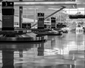 empty carousels at an airport baggage claim