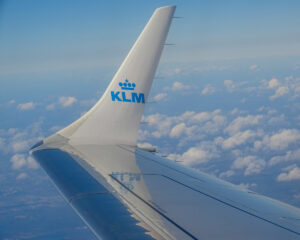 KLM aircraft winglet over clouds