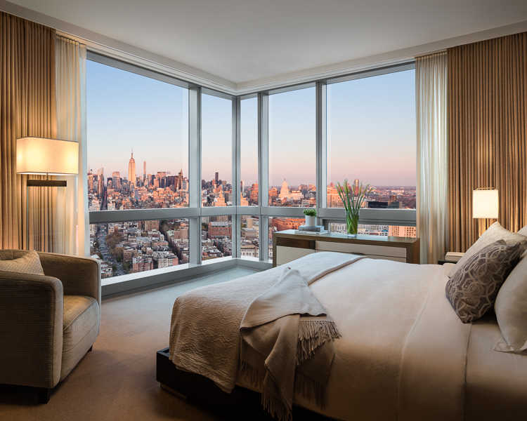 a hotel room at a Preferred Hotels corner room with large windows