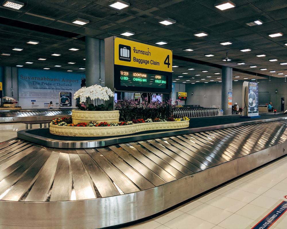 an empty carousel at an airport baggage claim