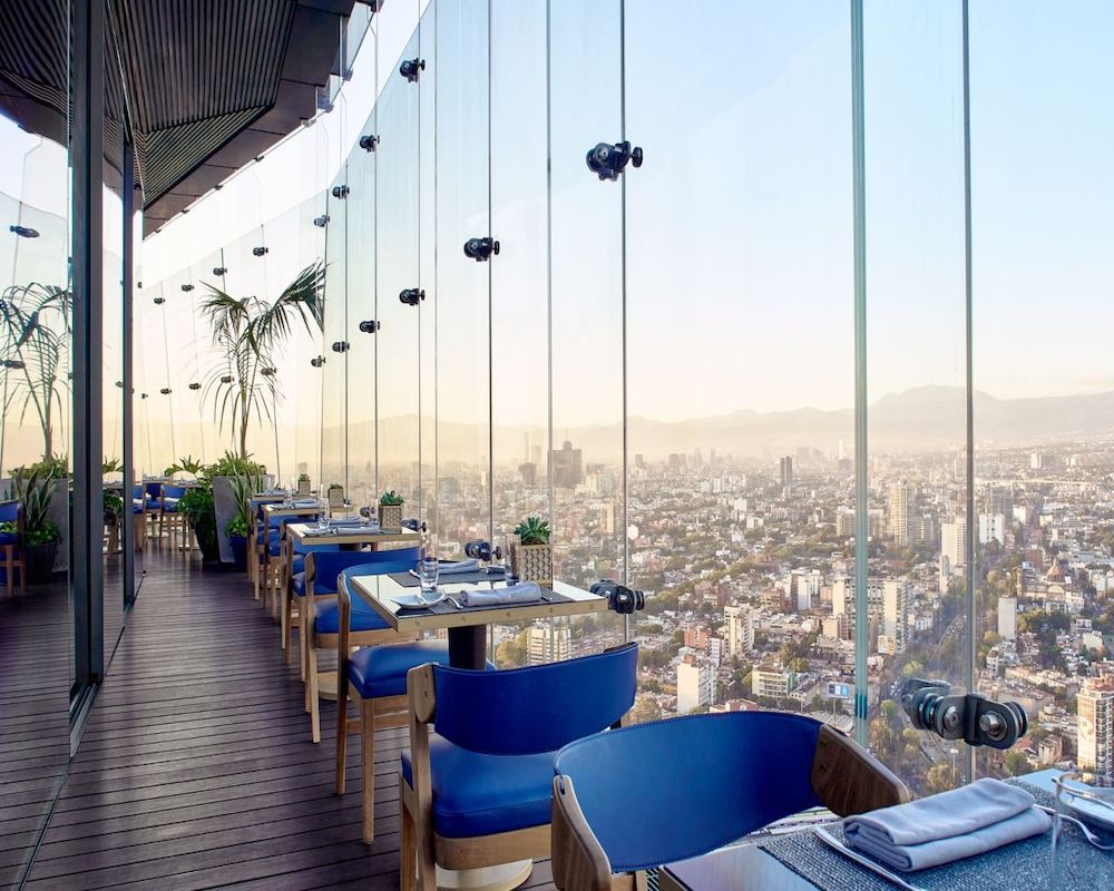outdoor seating at a rooftop restaurant at a hotel
