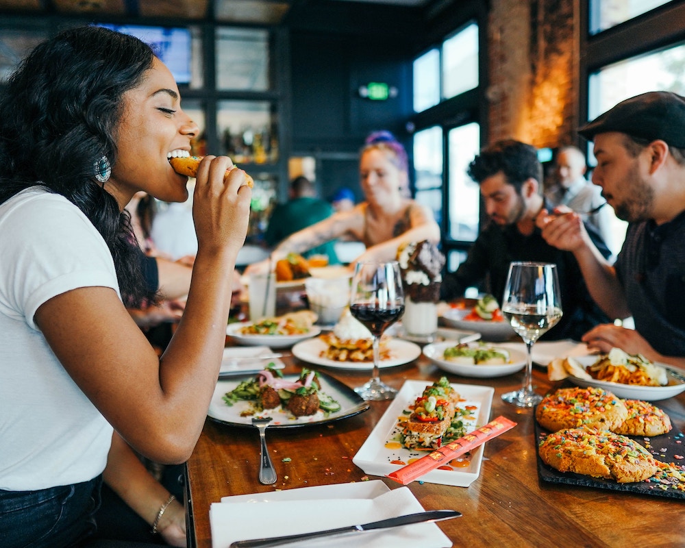 friends eat together at a restaurant
