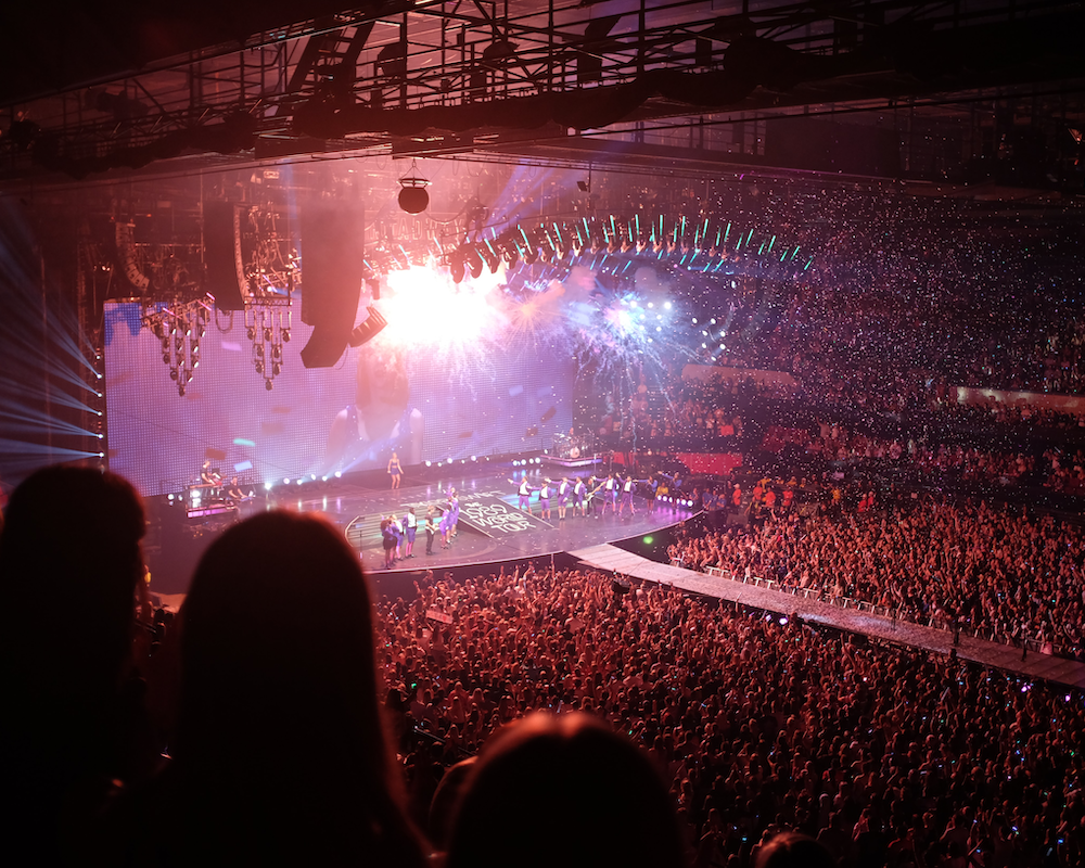 view from the crowd toward the stage at a Taylor Swift concert