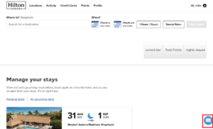 Hilton website showing chat button in bottom right corner