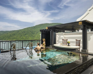 a couple in a private plunge pool at a luxury hotel in Vietnam