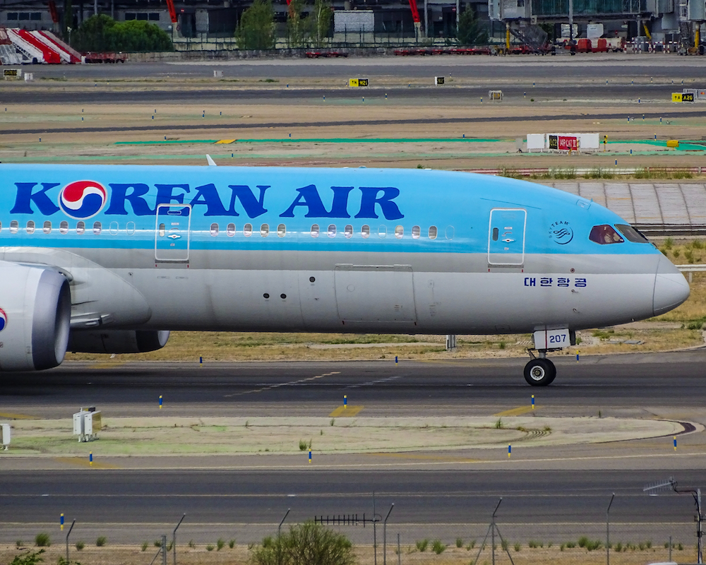 the front half of a Korean Air plane on a taxiway