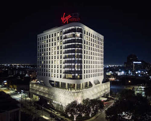 Exterior of Virgin Hotels Dallas as seen at night