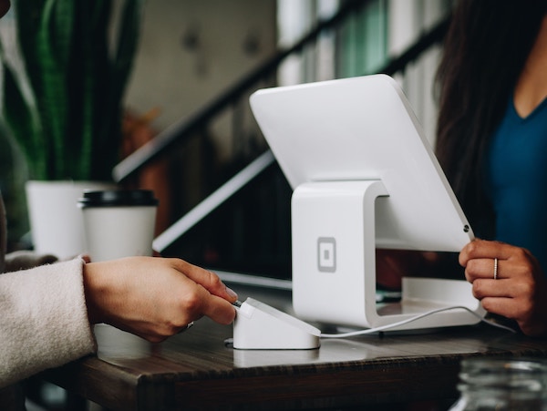 A person is making a purchase with a credit card.