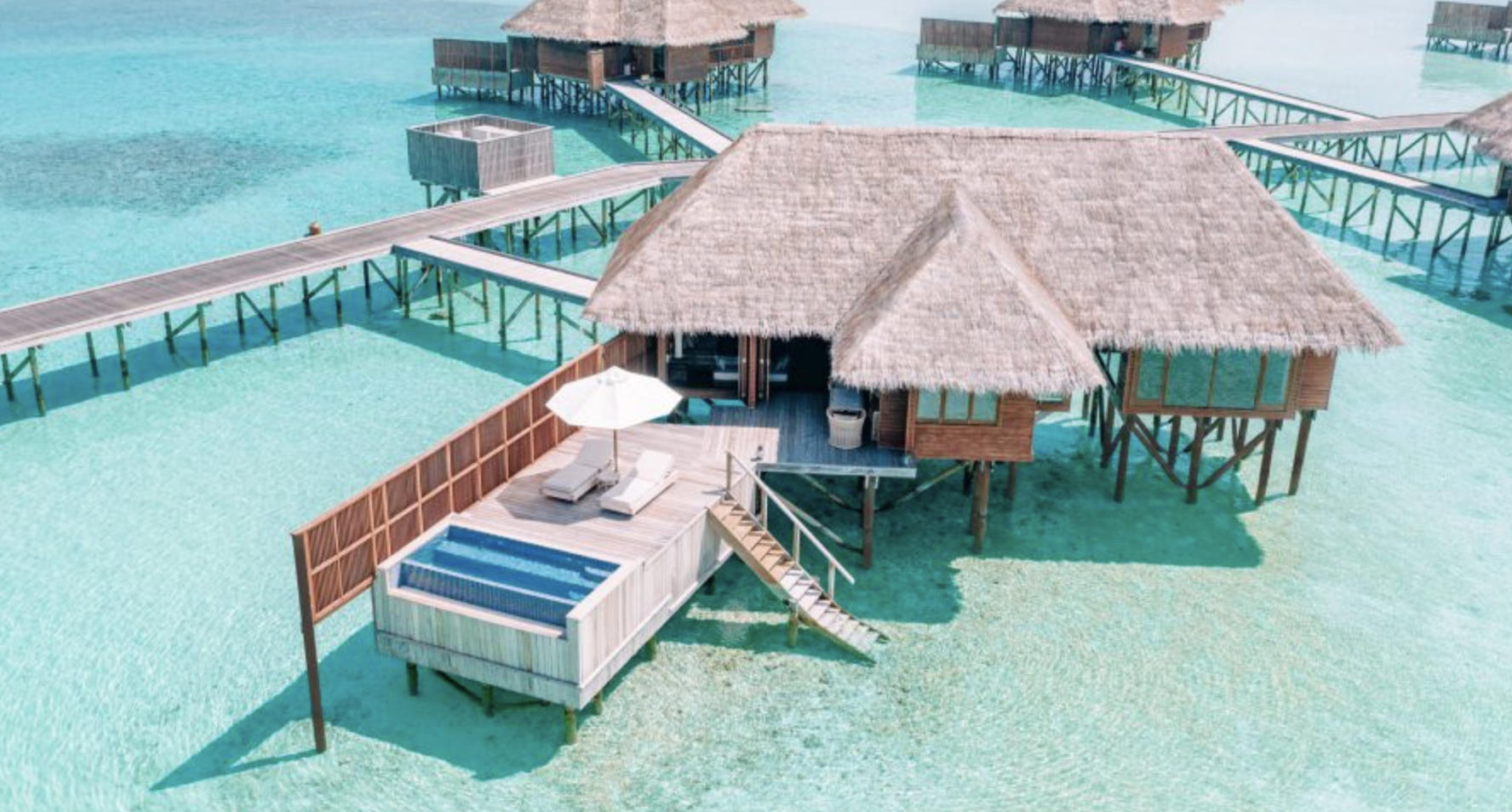 Aerial shot of an overwater bungalow at the Conrad Maldives Rangali Island