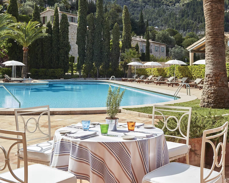 A photo of the pool from a dining table at La Residencia, A Belmond Hotel in Mallorca, Spain and an Amex FHR.