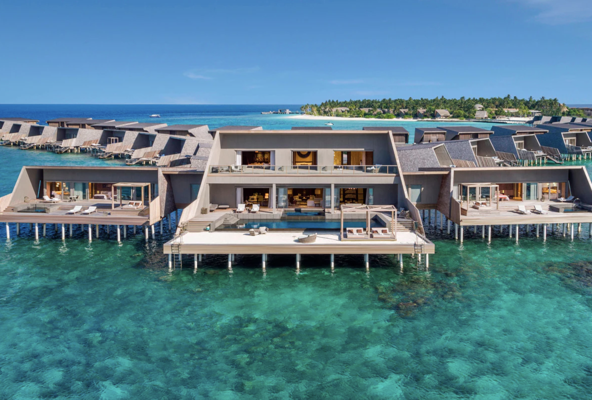 Aerial shot of the overwater bungalows at The St. Regis Maldives Vommuli Resort