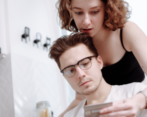 a couple looks at information about their credit card together