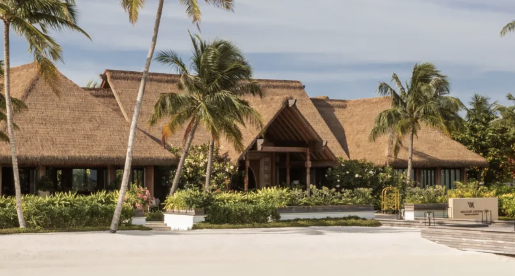Exterior of the cabana-style lobby at the Waldorf Astoria Maldives Ithaafushi