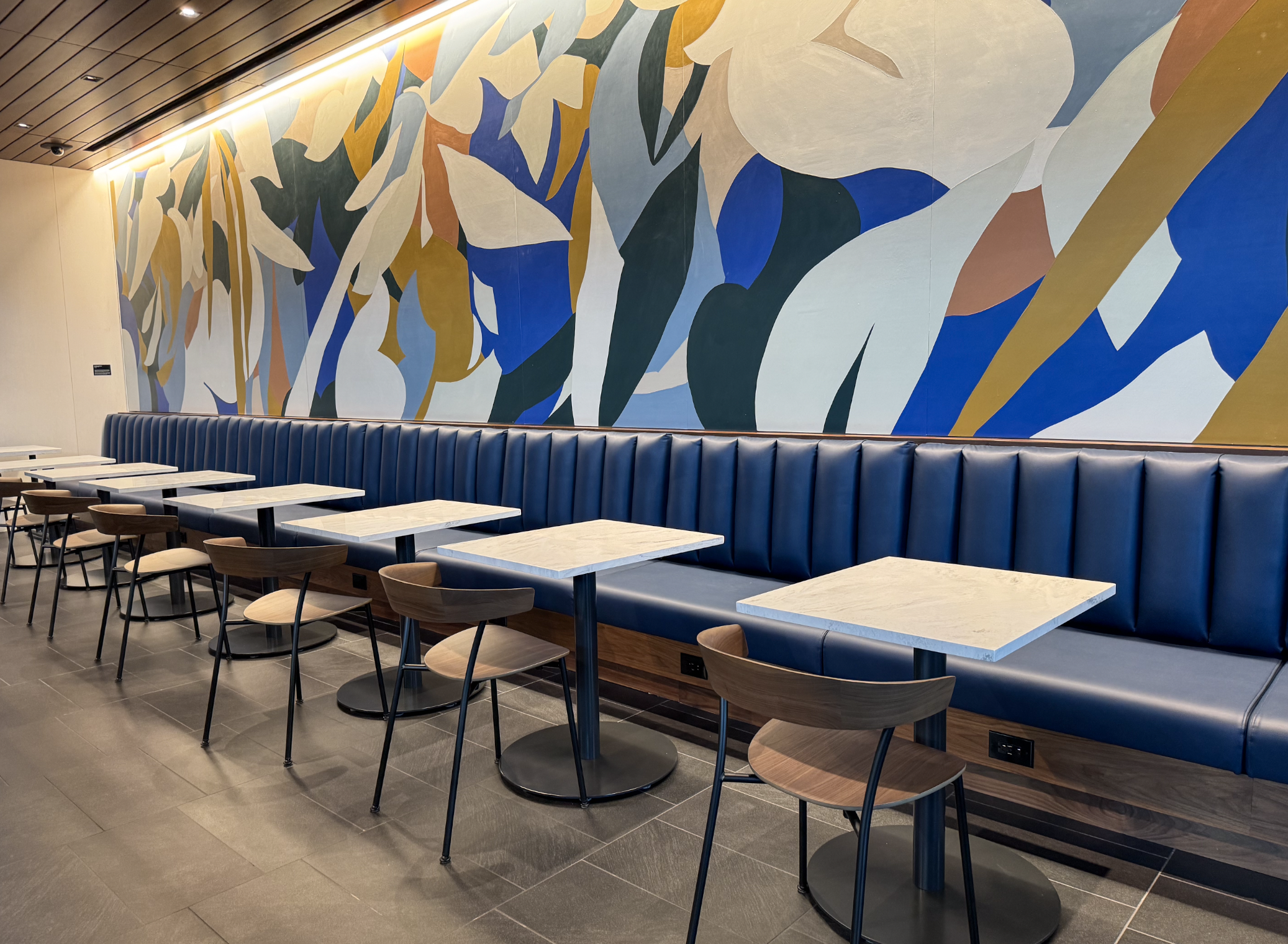 Dining tables in Amex ATL Lounge