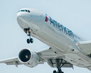 American Airlines 777-300ER landing at LAX in the daylight.