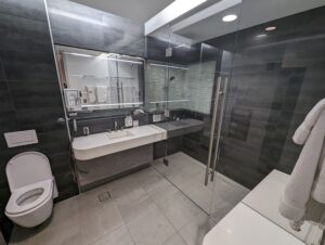 Individual shower suite in American Airlines Flagship Lounge Miami